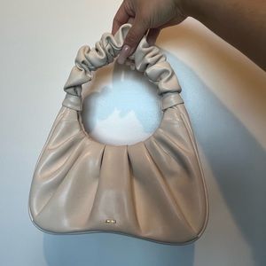 Small white handbag.